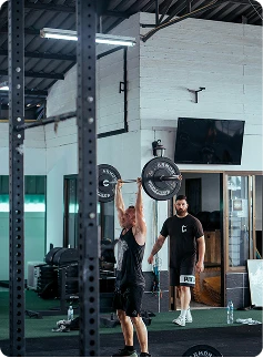 Person lifting weights at CrossFit gym